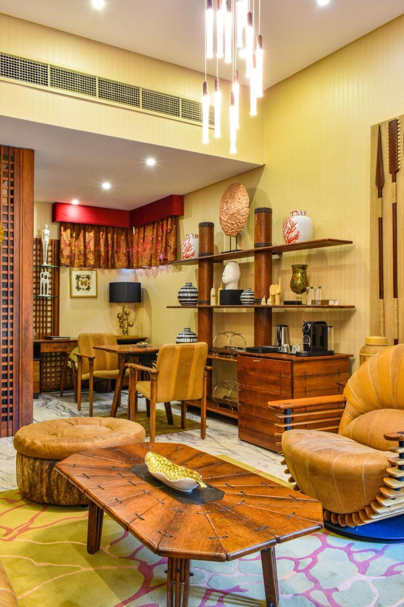 Palavra Resort Manama Exterior foto A living room in a suite at the hotel